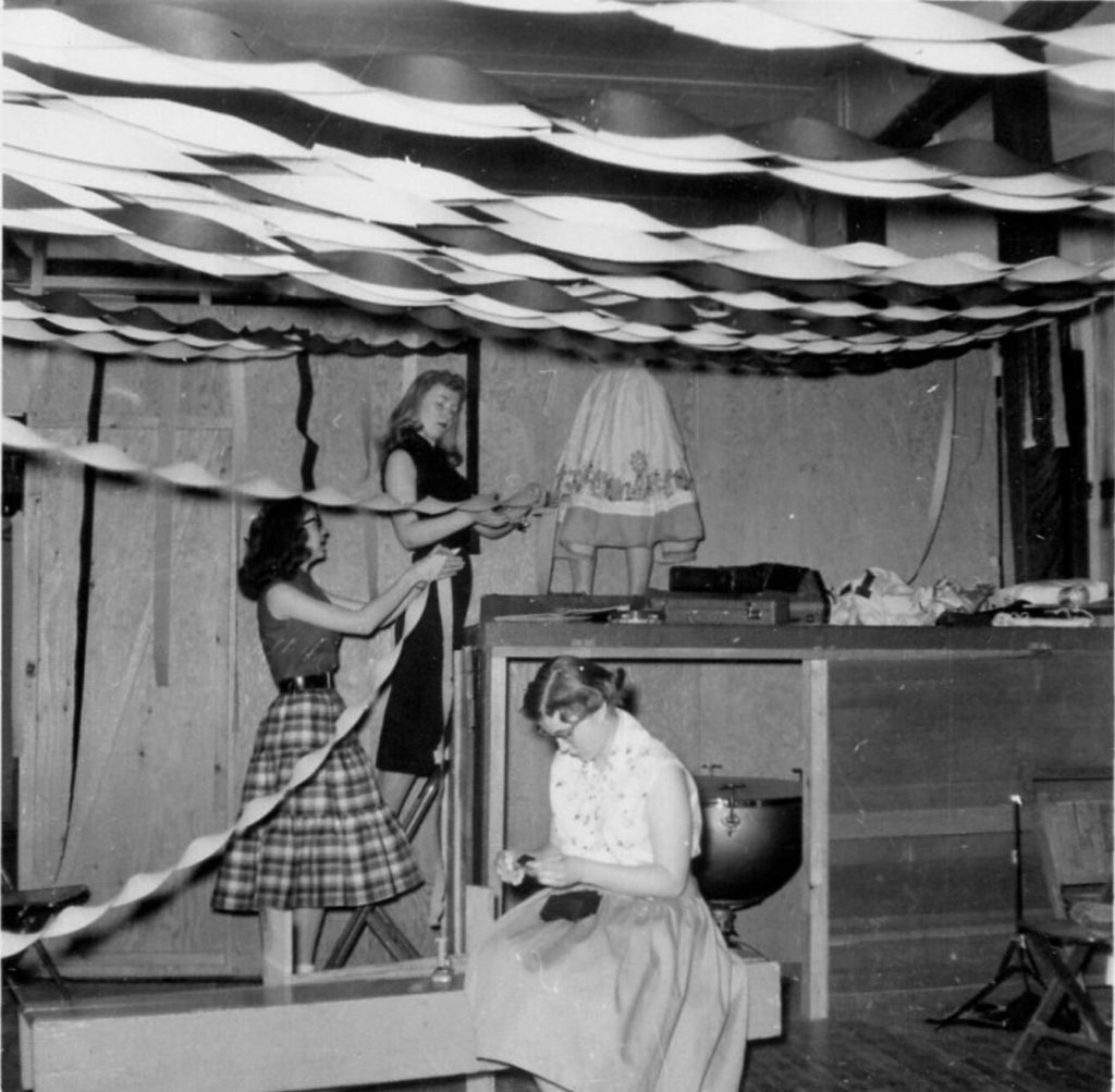 1950s Vintage Photo: 4 Teenage girls in 1950s fashions Decorating the Gym for a High School Dance with streamers. Fun 1950s Party Decoration idea. 