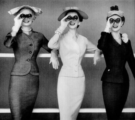 1950s vintage photo of three women in 1950s fashions. 