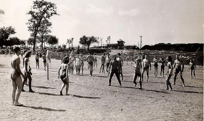 Vintage photo of people playing volleyball by the Niagara Falls Cyanamid Swimming pool