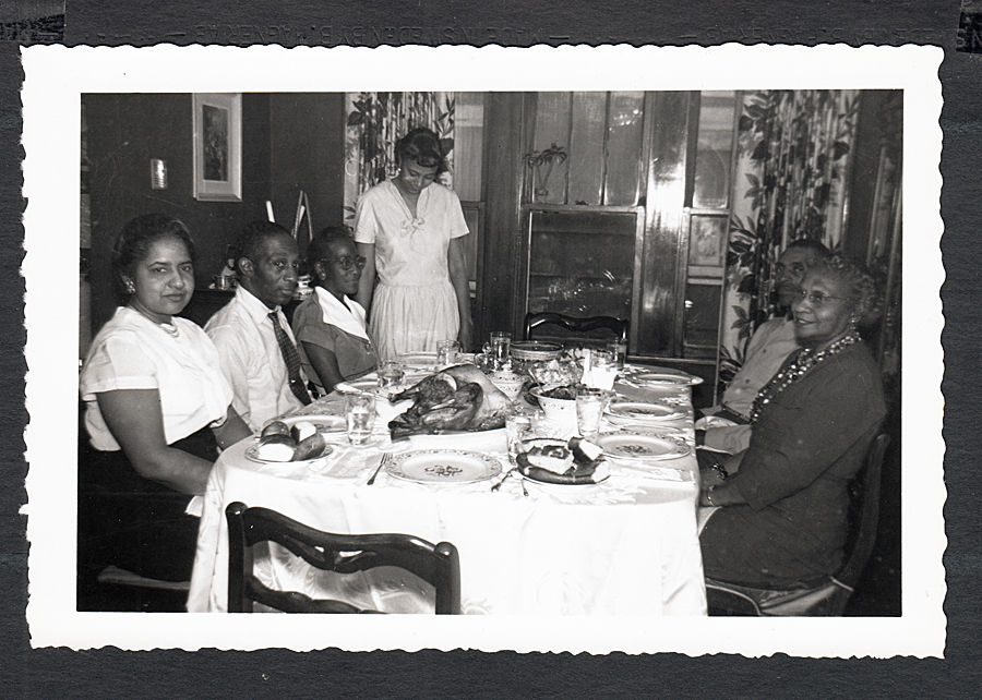 1950's african american / Black  family at thanksgiving dinner. 1950s vintage photo. 