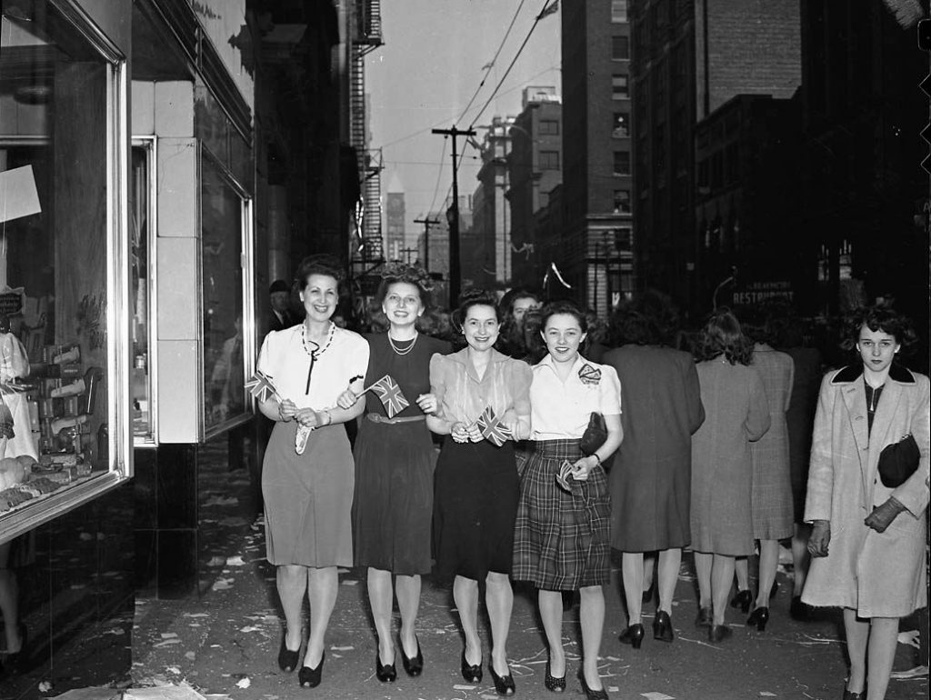 1940s vintage photo: Celebrating VE Day on Bay Street in Toronto. vintage photo of 4 women in 1940s fashions. 