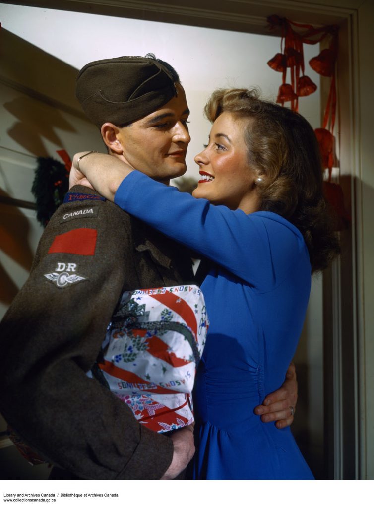 Pte. Lyle Enright Returning from Overseas for Christmas 1940s vintage photo of couple ww2
