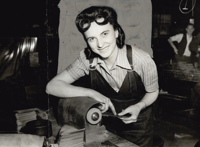 1941 vintage ww2 photo of a canadian woman working on an airplane part for the war effort vintage photo