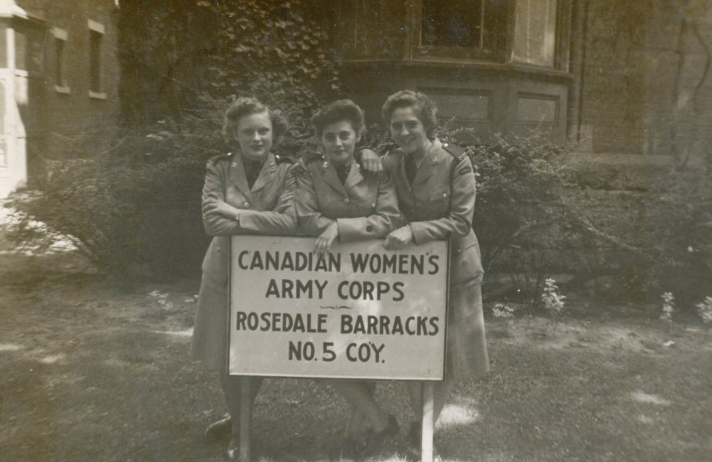 Alene Quick poses with friends outside the Canadian Women's Army Corps, Rosedale Barracks, where she stayed. 1940s The Memory Project vintage photo