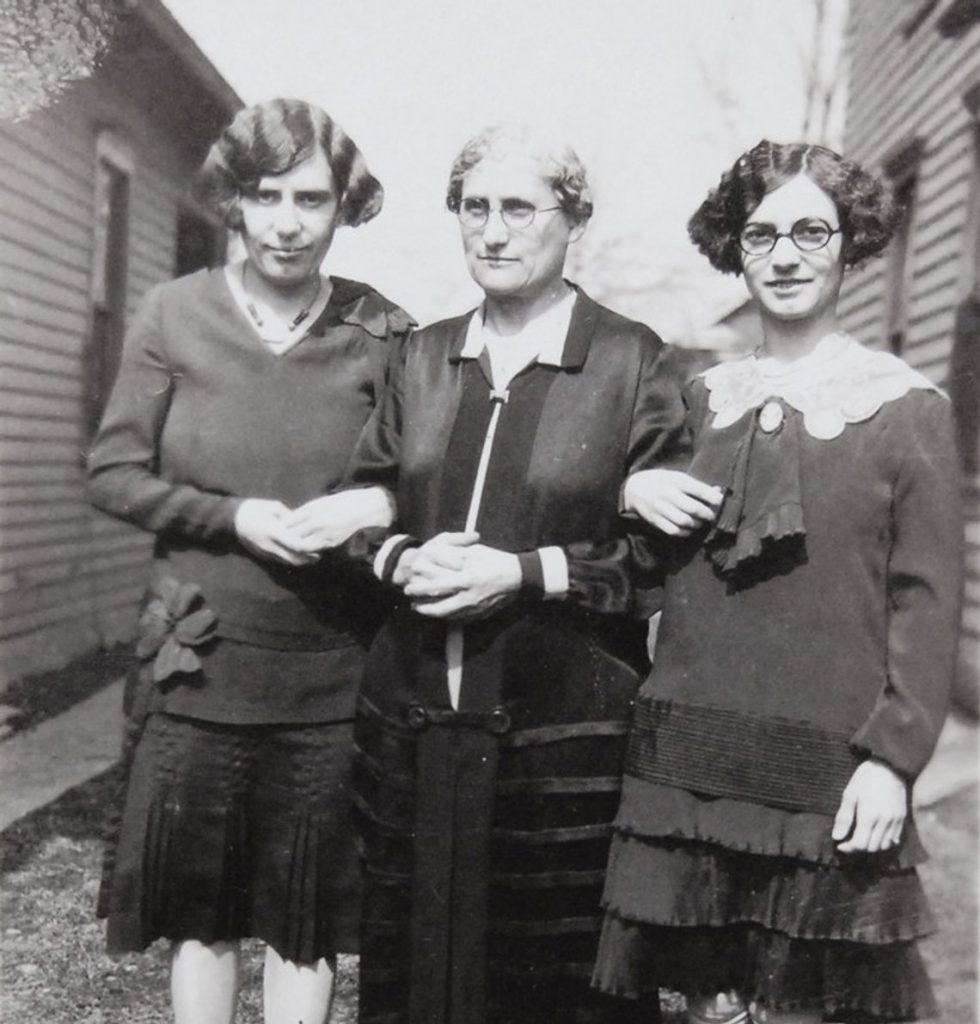 1920s vintage photo of three women (2 sisters and mother) in 1920s fashions and 1920s hairstyles. 