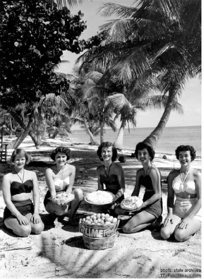 1950s vintage photo of a group of women in 1950s swimsuits posing with key lime pies for the Key Lime Festival in Key West Florida 1953