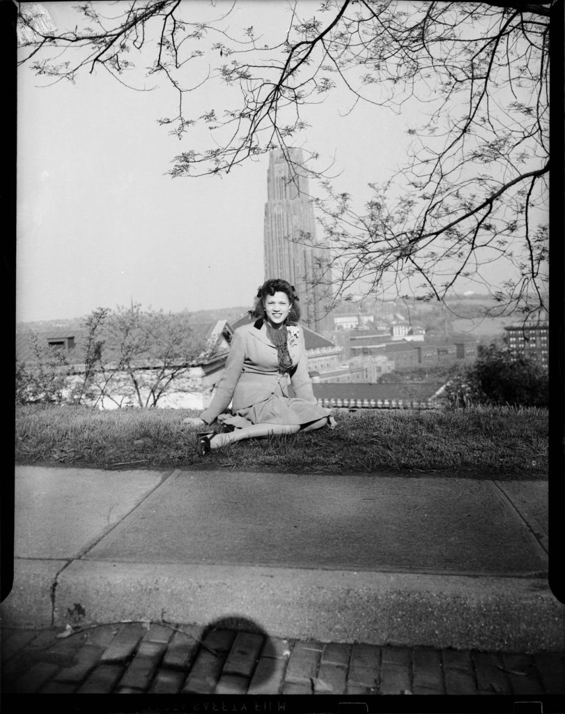 1940s Photo of a Black Women Elsa Lee Elliott Harris, wife of Charles “Teenie” Harris, with University of Pittsburgh and Cathedral of Learning in background, Oakland