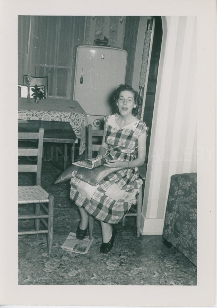 Surprised Housewife Caught Reading A Magazine in The Kitchen! Vintage Photo from the 1940s. 