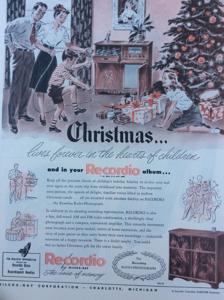 1940s Vintage ad for a Recordio-A recording radio-phonograph featuring an illustration of a family gathered around the radio and the Christmas Tree. 