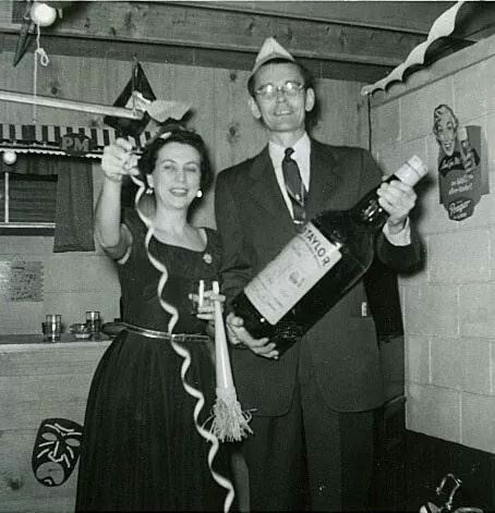 1950s vintage photo of a basement New Years Eve Party featuring a man and woman