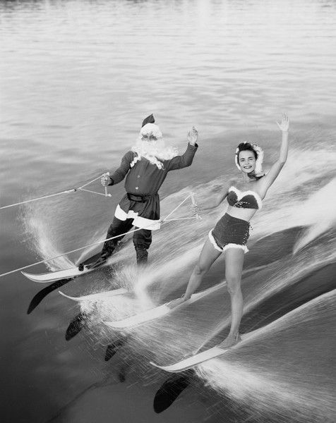 1954 vintage photo of Santa Claus Water Skiing With Female Friend