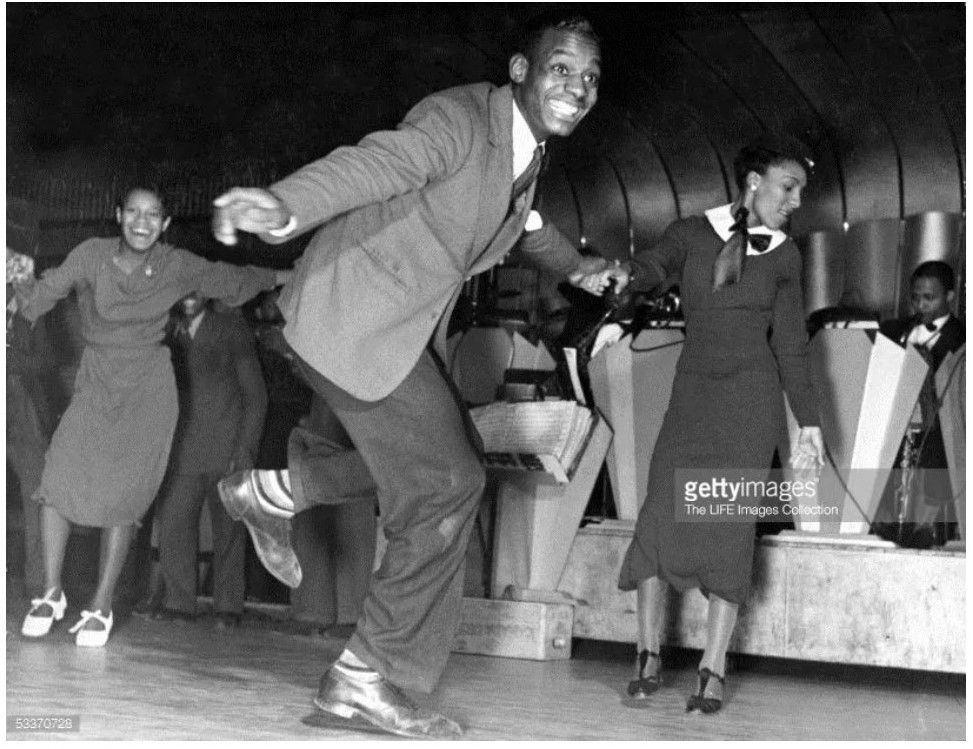 1930s Vintage photo of Black Dancers dancing the Lindy Hop at the Savoy Ballroom.