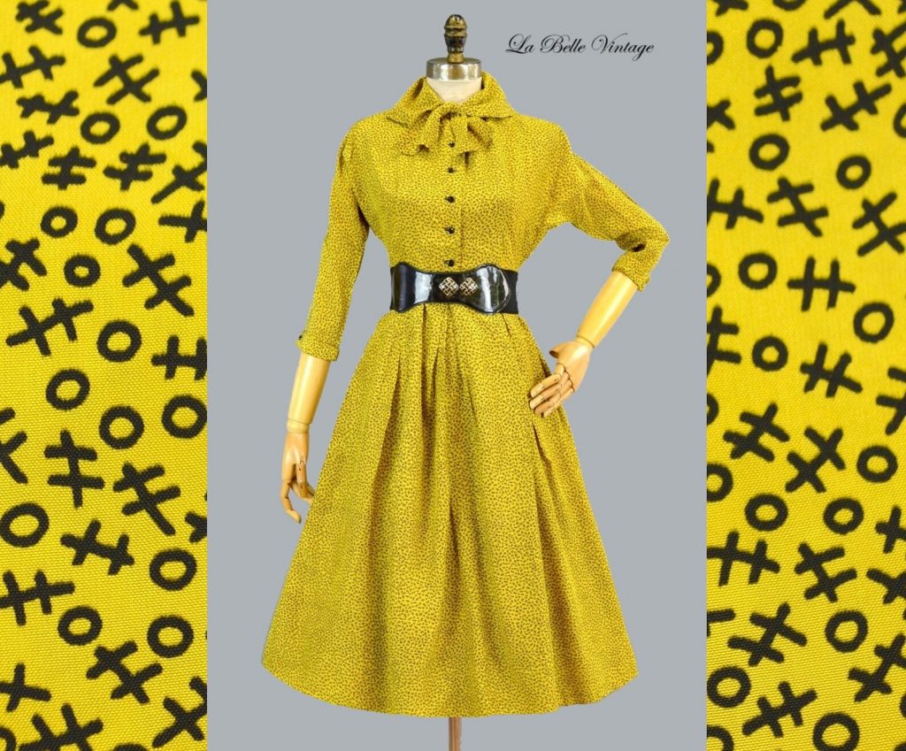 1950s Fashion: 1952 Jonathan Logan dress in yellow with a tic-tac-toe pattern on the dress. 