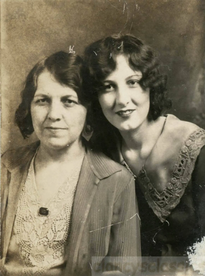 1930s vintage photo booth image of a mother and daughter in 1930s fashions and 1930s hairstyles. 