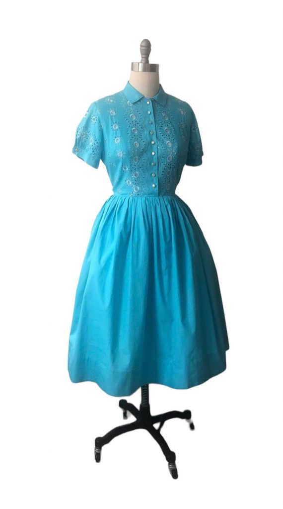 1950s Fashion: Lovely turquoise blue cotton dress / Vicky
Vaughn 1950’s fit & flare dress - button front with side metal zipper - eyelet embroidered bodice - full pleated skirt bottom - Bloused top with full sleeves button closure on sleeves -  The perfect spring summer dress in vibrant color!