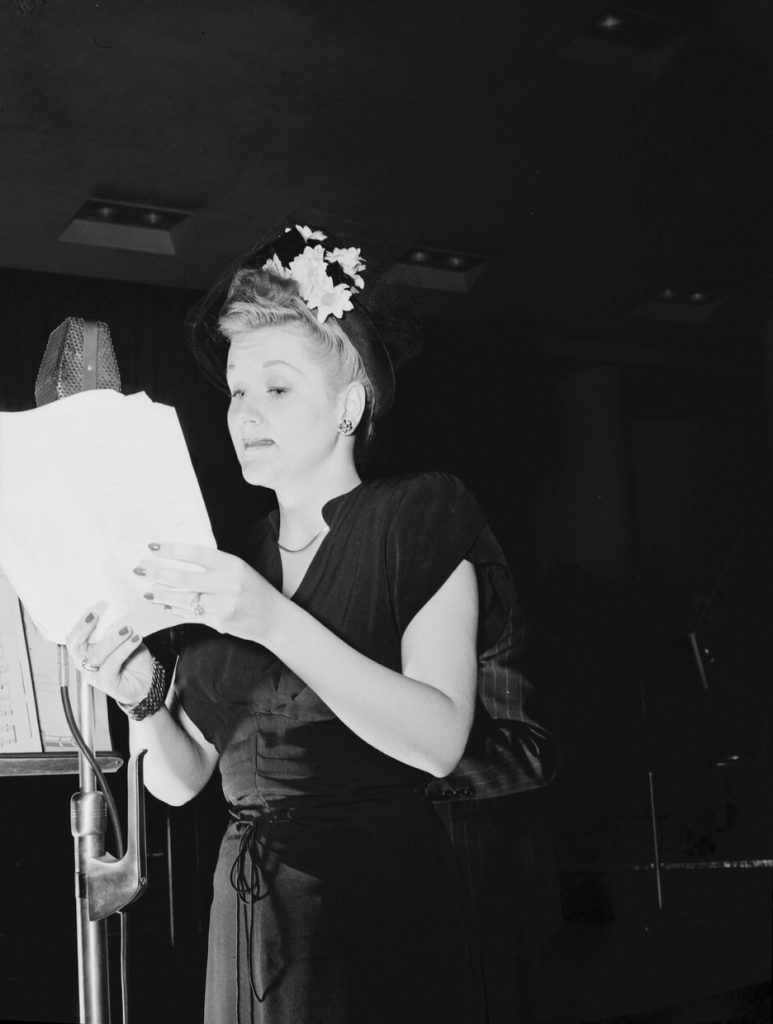 1940S Vintage photo of big band singer, Margaret Whiting in the late 1946 looking at music. 