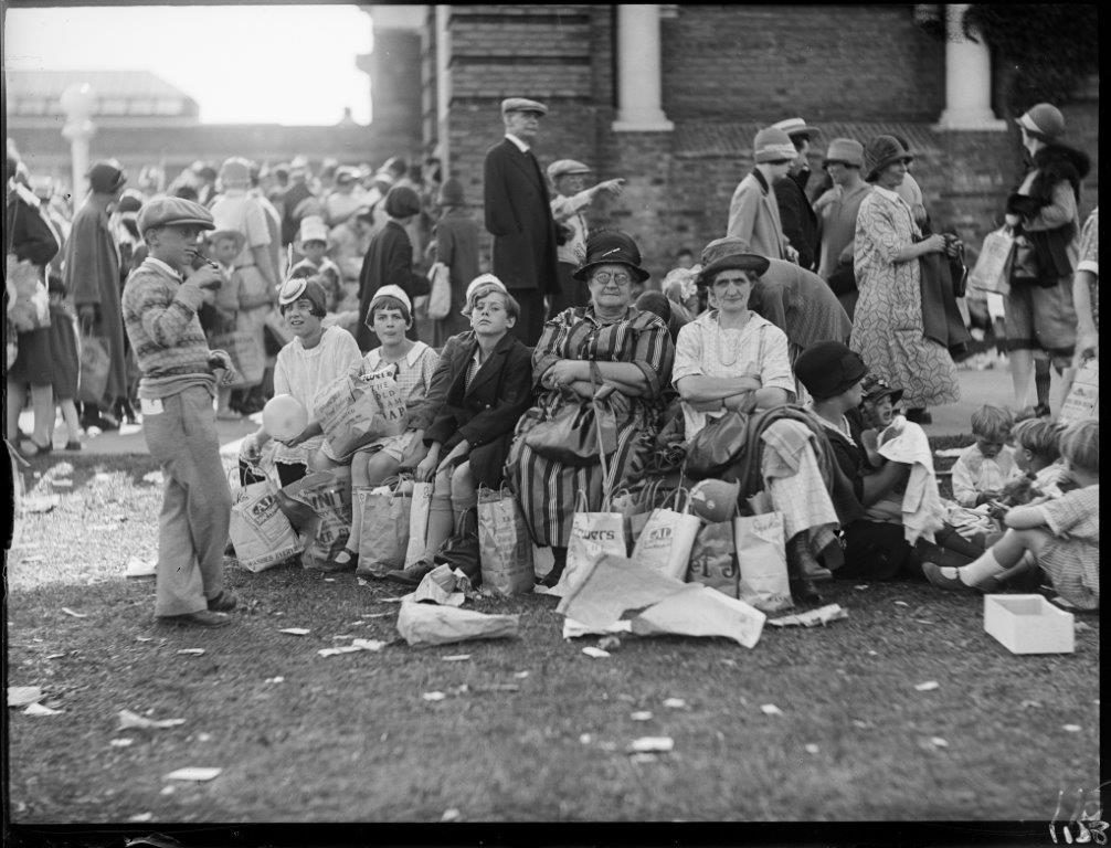 1920s vintage photo from Toronto's CNE Canadian National Exhibition of a family in 1920s fashions sitting down and taking a break in 1926