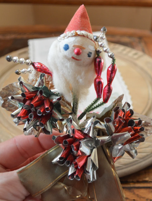 1930s / 1940s  Vintage Christmas Corsage: Santa w/ 3 foil rosettes and ribbon.  ==> See more Vintage Christmas Brooches & Corsages: The Ultimate Festive Accessories at the Vintage Inn Blog.