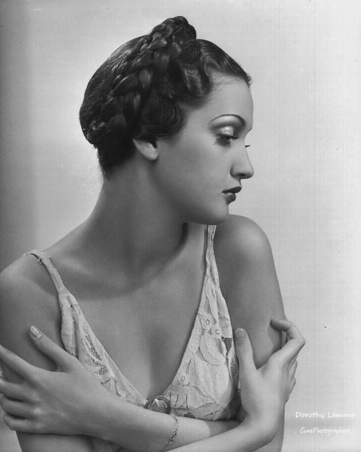 1930s vintage photo of Dorothy Lamour 1936. Dorothy is wearing a 1930s hairstyle, a 1930s braid-Crown Braid / Coronet  braid. 
