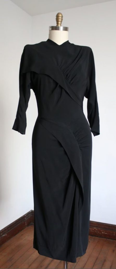 1940s fashion: 1940s black rayon draped Dorothy O'Hara Dress with dramatic sleeves and incredibly cool drapery details.
