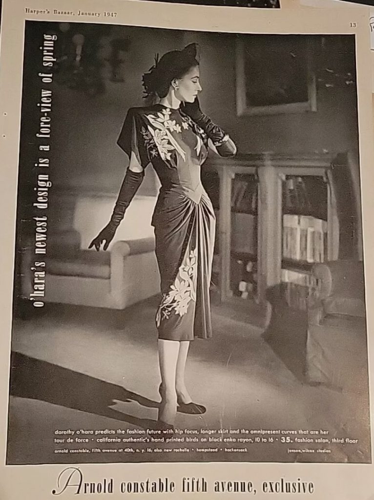 1940s Fashion Advertisement: 1947 Dorothy O'Hara Dress advertisement. Dorothy O'Hara predicts the fashion future with hip focus, longer skirt and the omnipresent curves that are her tour de force'. "California authentic hand printed birds on black enka rayon"