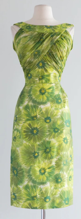 1960s Fashion: 1960s green floral silk cocktail dress by Dorothy O'Hara with the most beautiful draping on the bust area. The back is a low scoop.