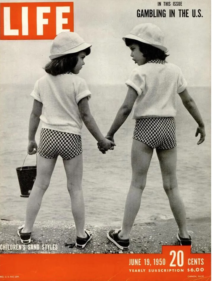 1950s vintage magazine cover for Life magazine from June 19 1950 featuring two girls in matching summer outfits standing on the beach