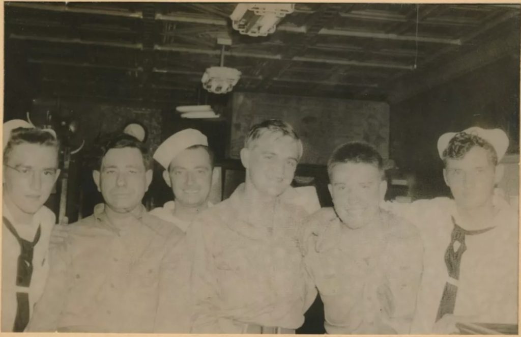 1940s vintage photo: A group of Navy men having some fun during shore leave at 'Palace Bar and Grill' in New York City as seen in a souvenir photo. 